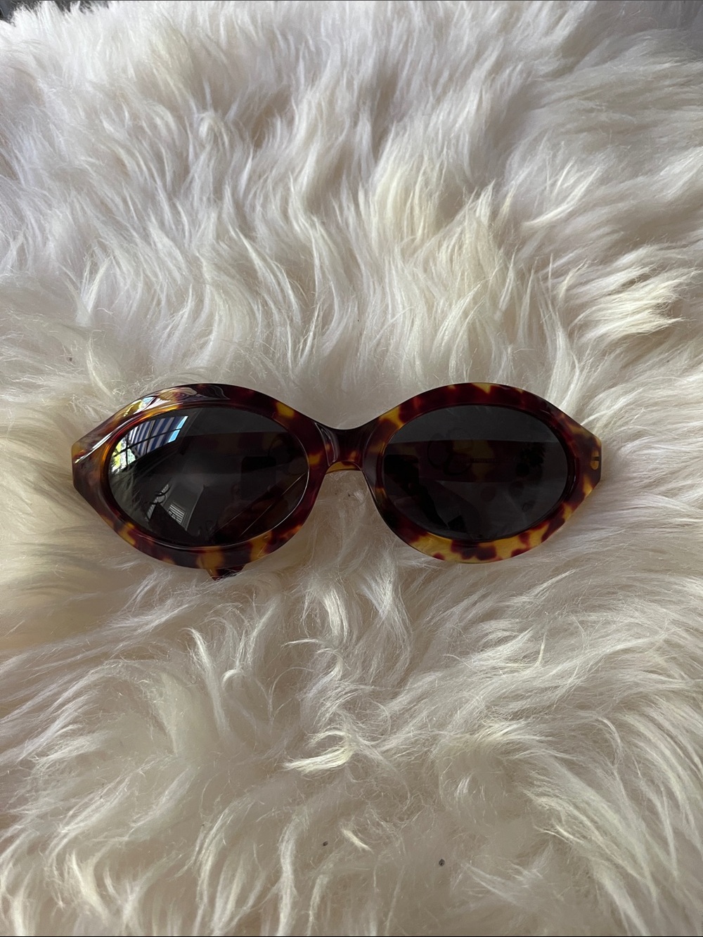 Gucci Tortoiseshell Oval Sunglasses with Dark Lenses
